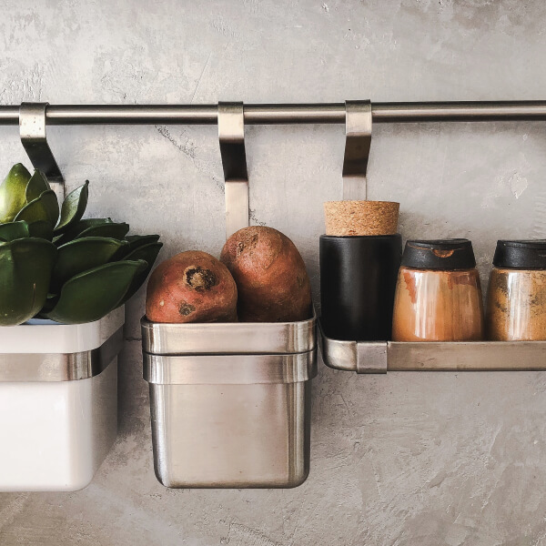 Kitchen shelf with pots and pans, illustrating a project to manufacture custom kitchen cabinets.